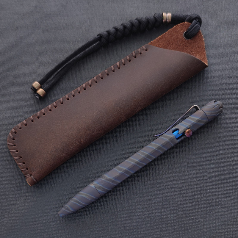 Blue Flamed Titanium TiBolt pen with the included leather sleeve